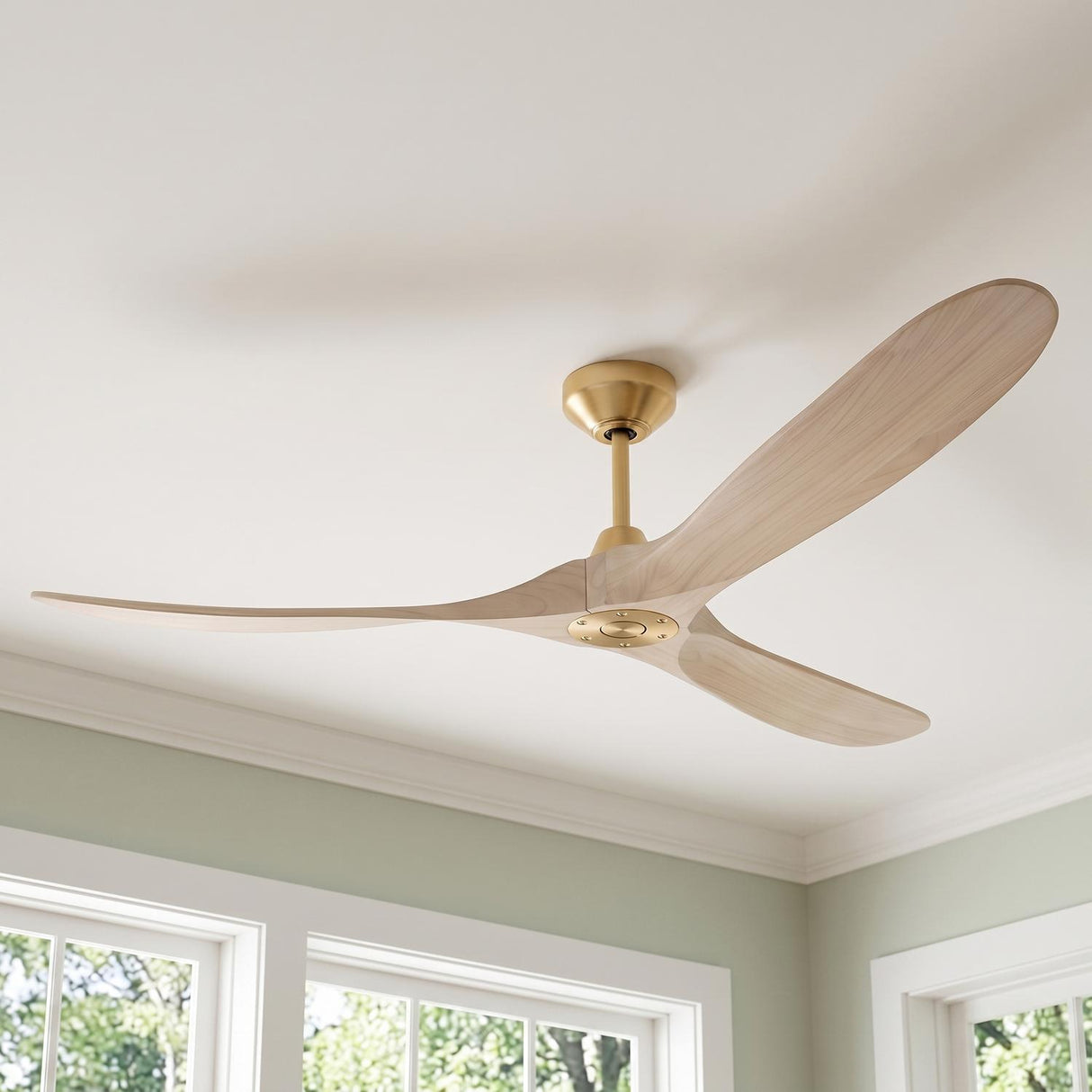 A transitional living room with the Egret Ceiling Fan 70", Whitewash Oak and Modern Brass featuring brushed brass hardware and sculptural wood blades against sage green walls.
