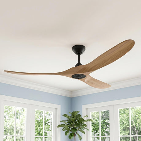 A transitional living room with an Egret Ceiling Fan 70", Natural Oak and Matte Black on a white ceiling beside blue walls and white multi-pane windows.