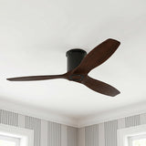 A transitional bedroom featuring the Harrier Smart Ceiling Fan 52" in walnut wood and matte black mounted to a white ceiling above gray striped wallpaper.
