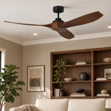 A warm transitional living room with the Heron Smart Ceiling Fan 60", Walnut Wood and Matte Black mounted above a beige sofa and dark wood bookcase.