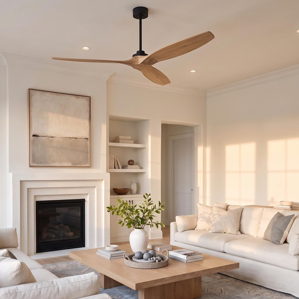 A contemporary living room with the Heron Smart Ceiling Fan 70" featuring natural oak blades and matte black finish centered over a wood coffee table near the fireplace.