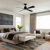 A modern bedroom featuring the Sora Ceiling Fan 44" in matte black installed on the ceiling center above a neutral upholstered bed and plaid area rug.