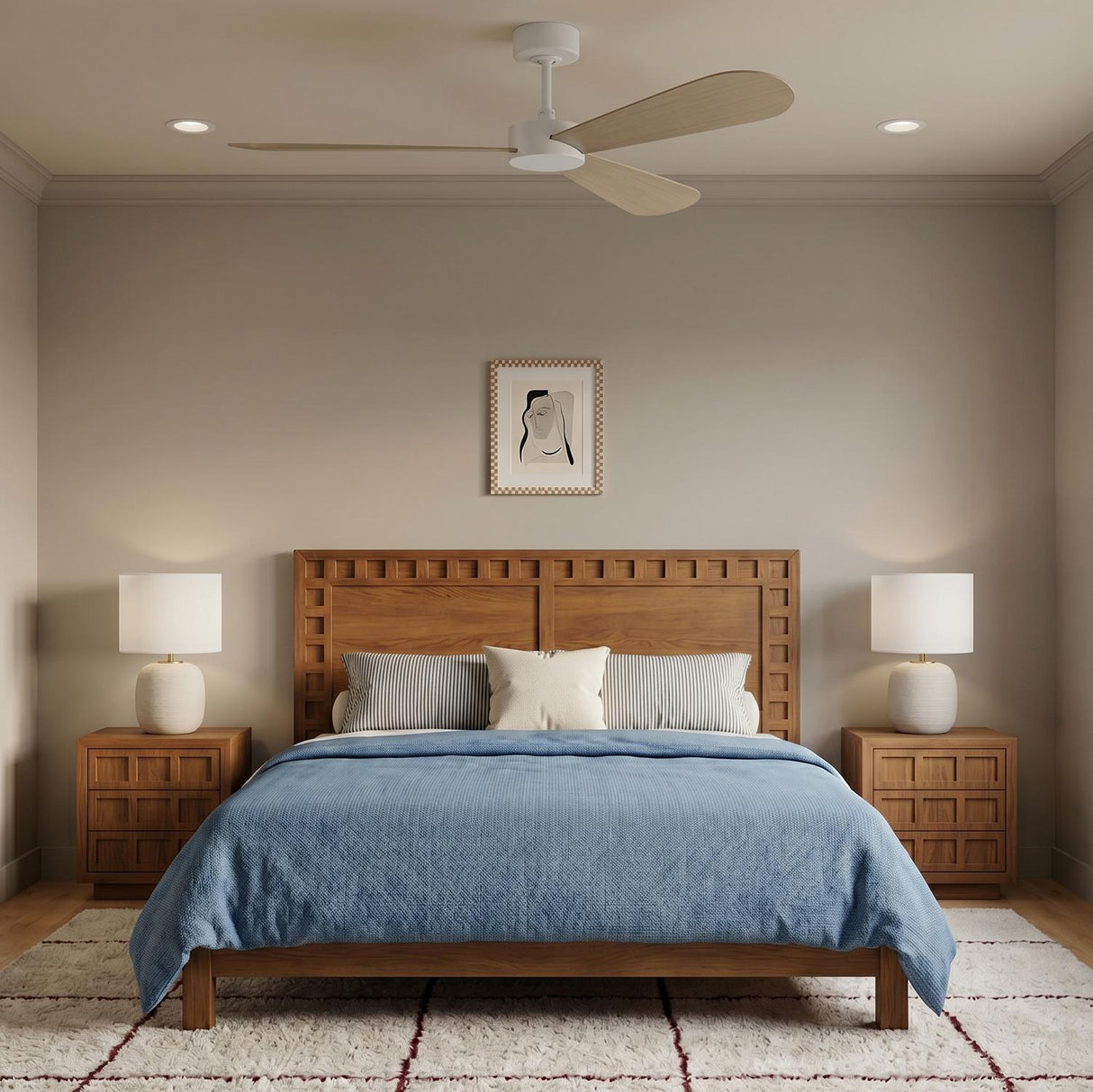 A transitional bedroom featuring the Willet Smart Ceiling Fan 60 in matte white and bleached oak above a wood bed with blue bedding and ceramic lamps.