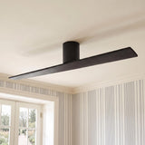 A transitional living room featuring a matte black oak Finch Smart Ceiling Fan 60" mounted to the ceiling center above blue and white striped wallpaper.