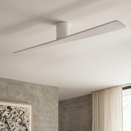 A minimalist living room with the Finch Smart Ceiling Fan 72" in Matte White Oak along the ceiling center beside concrete walls and neutral curtains.
