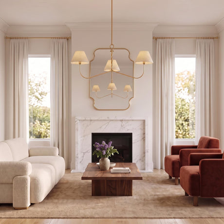 A transitional living room with a gold leaf Thornton Chandelier 48" with natural linen shades hanging over a walnut coffee table and white marble fireplace.