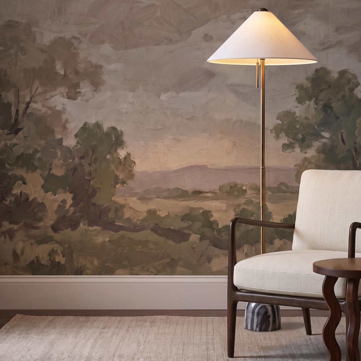 A transitional living room features the Hendrix Floor Lamp 64", Gray Marble and Patina Brass with a white cone shade beside a cream armchair and landscape mural.