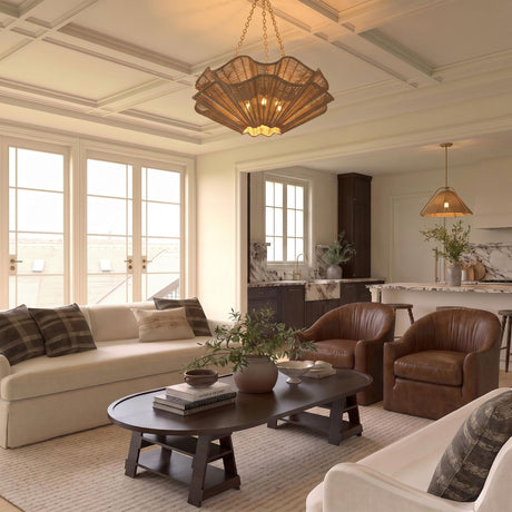 A transitional living room with the Andorra Extra Large Chandelier 44 inch in natural jute and gold leaf along a white coffered ceiling above leather armchairs.