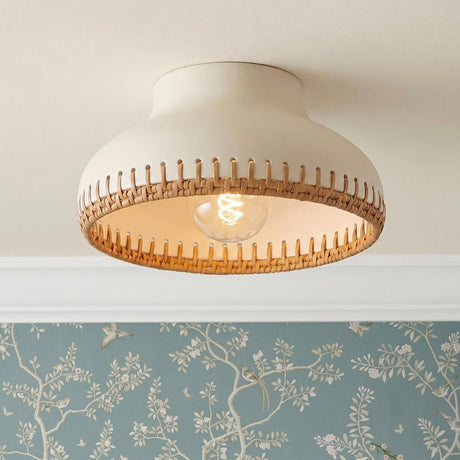 A cottage bedroom featuring the Nadira Semi-Flush 11 inch Cream and Rattan light on a white ceiling above blue floral bird-patterned wallpaper and white crown molding.