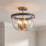 A transitional foyer with the Ramona Semi-Flush 13", Brass and Vintage Blue flush mount installed on a white ceiling with crown molding and beige wallpaper.