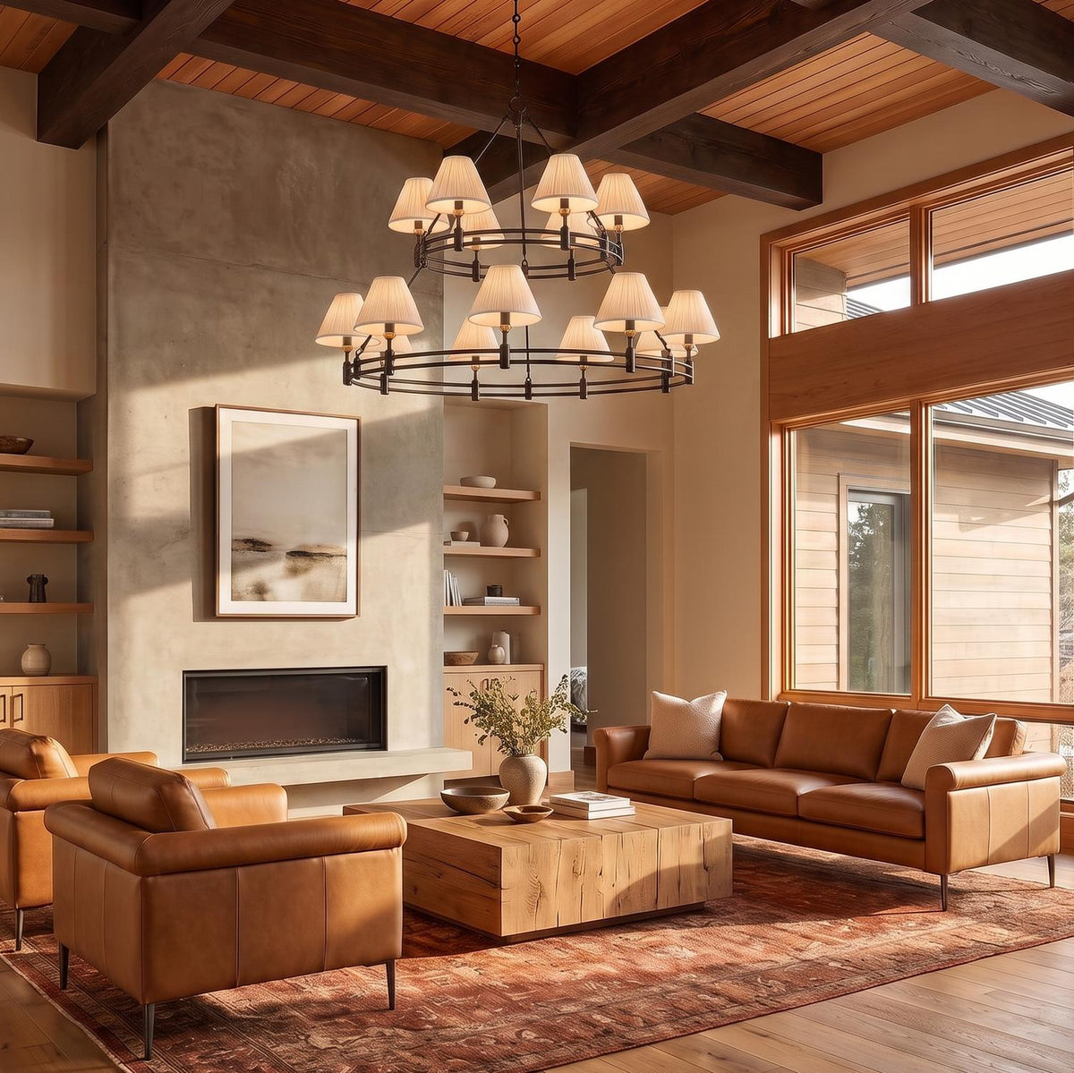 A Craftsman living room features the Rafferty Two-Tier Chandelier in distressed bronze hanging from a dark wood beamed ceiling above cognac leather seating.