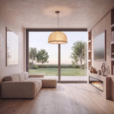 A modern living room with the Emiko Extra Large Pendant 30", Bronze Leaf and Paper Shade suspended above light wood floors and a linear fireplace.