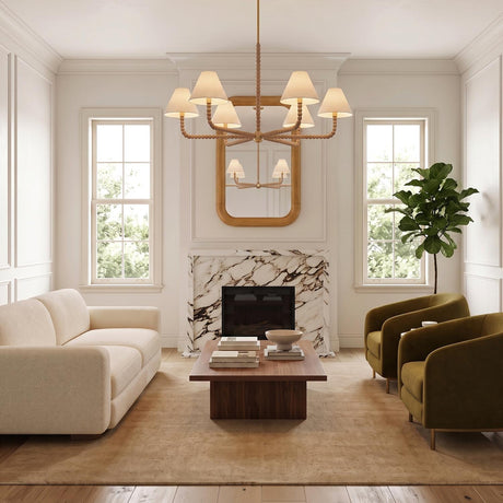 A transitional living room with a natural wood-beaded chandelier and linen shades centered over a walnut coffee table beside a marble fireplace and olive armchairs.