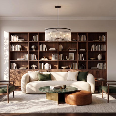 A mid-century living room featuring the Marcella 6 Light Chandelier 36", Matte Black with glass rods over a green marble coffee table and cream bouclé sofa.