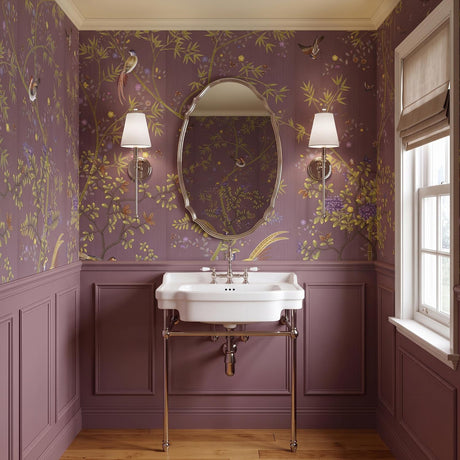 A traditional bathroom with two Bellamy Wall Sconce 20", Polished Nickel and White Fabric fixtures flanking an oval mirror above a white console sink and mauve floral wallpaper.