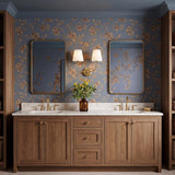 A traditional bathroom with the Estelle 2 Light Vanity Sconce 14", Brass and Opal Glass centered between two mirrors above a walnut double vanity and floral wallpaper.