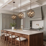 A transitional kitchen features three Alison Pendant 16-inch fixtures in antique bronze and antique gold over a walnut island under a coffered ceiling.