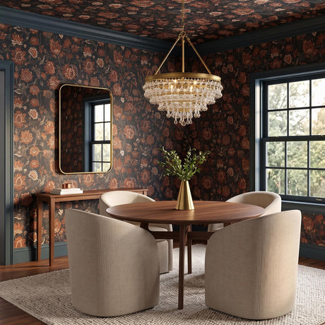 A traditional dining room with the Betony 6 Light Chandelier 20", Aged Brass hanging over a walnut table surrounded by beige chairs and floral wallpaper.