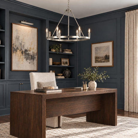 A transitional home office features the Trenton 6 Light Chandelier 28", Brushed Nickel hanging above a rich wood desk surrounded by dark navy paneled walls.